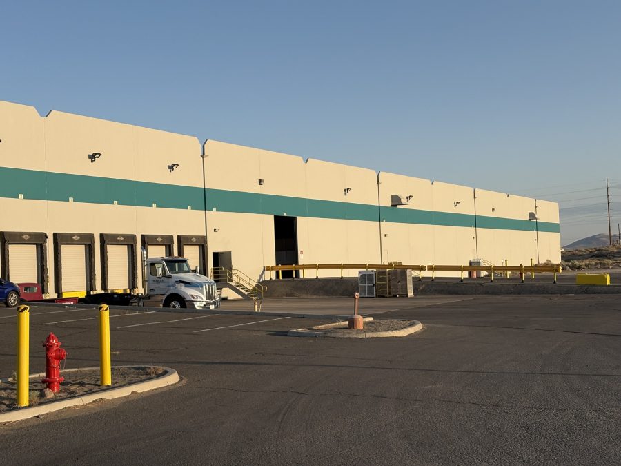 rear/loading bay side of industrial building painted off white with teal accent Preview Image 5