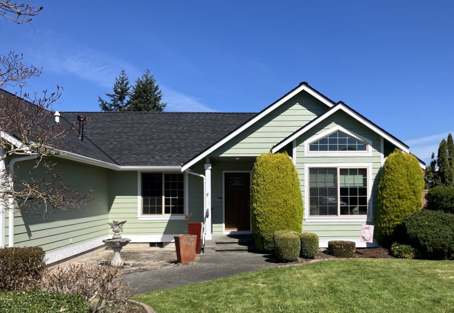 front exterior of house after light green repaint