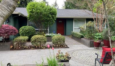 front exterior of two tone green painted house
