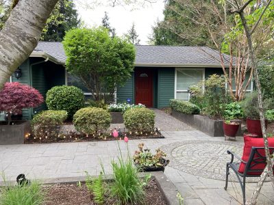 front exterior of two tone green painted house