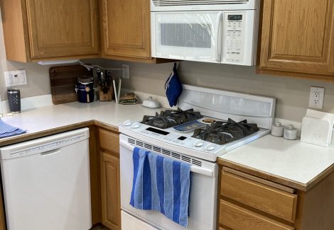 home kitchen with stained wood cabinets