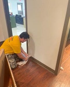 One of Our Crew Painting the Trim