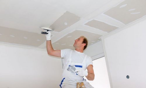 home painter preparing work surface for paint