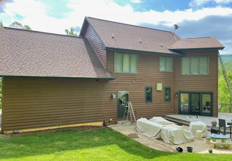 back of residential house exterior during painting