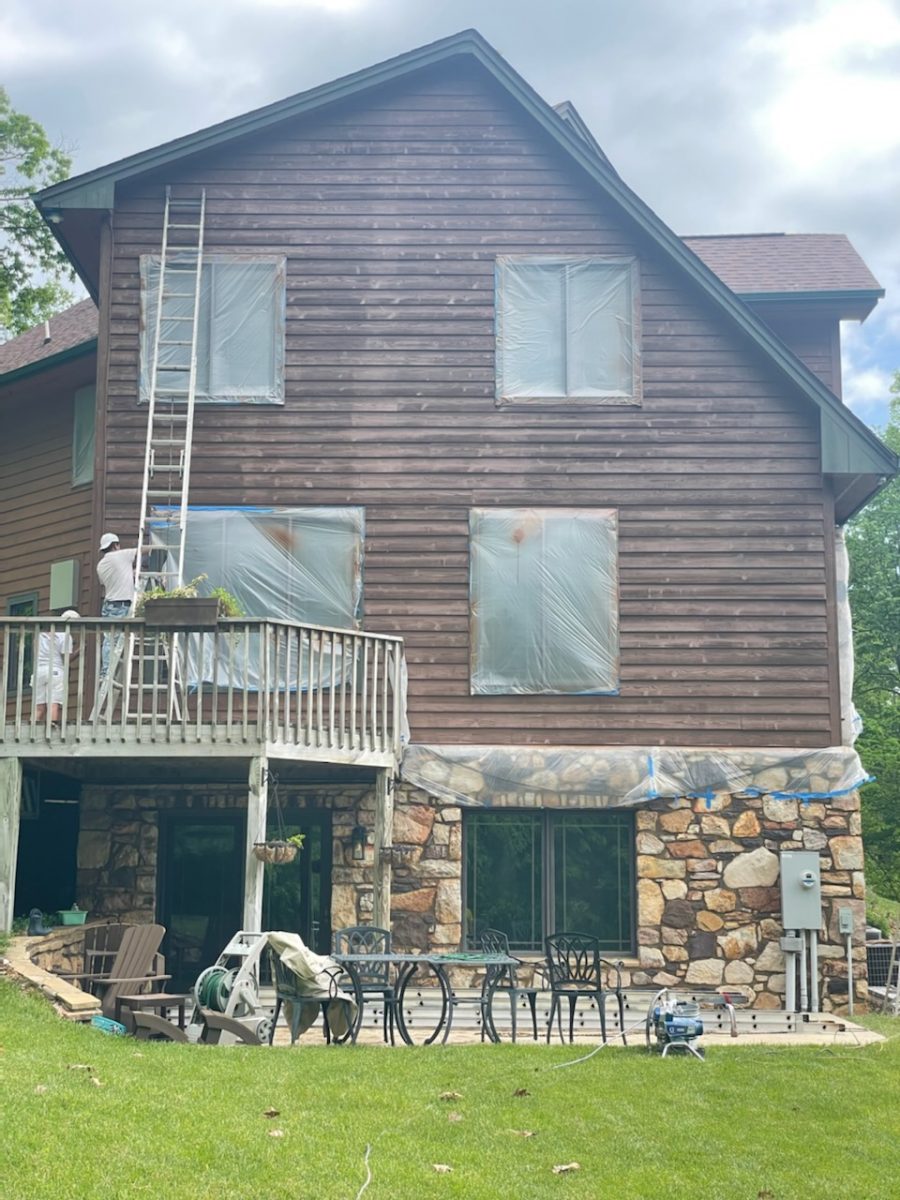 Back of residential home exterior during painting project Preview Image 1