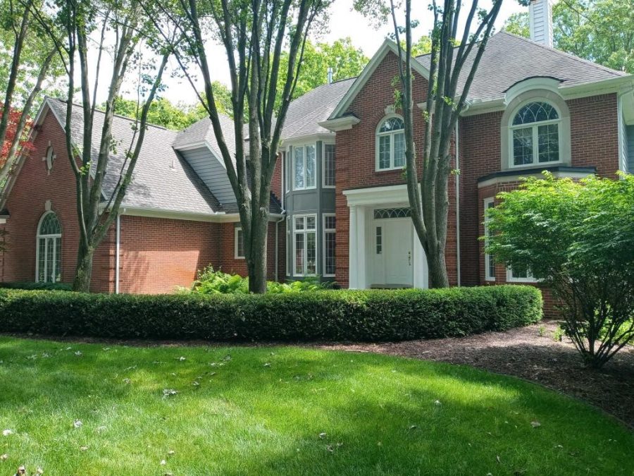 Brick front of house with gray trim and siding. Preview Image 2