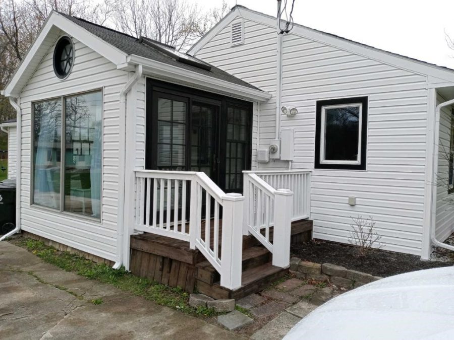 Deck railings painted white with black window trim. Preview Image 4