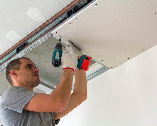 Drywall repair being done in a commercial office