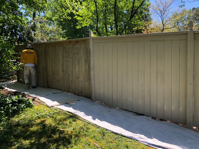 in progress photo of restained fence in marietta ga by certapro painters of roswell Preview Image 1