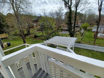 photo of repainted deck, fence, and pergola