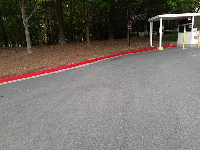 photo of repainted red fire lane curb in alpharetta Preview Image 2