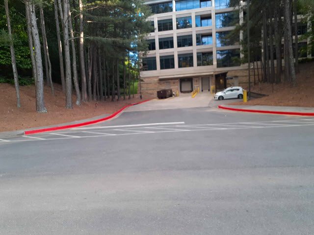photo of repainted red fire lane curb in alpharetta Preview Image 1