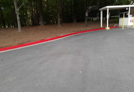 photo of repainted red fire lane curb in alpharetta