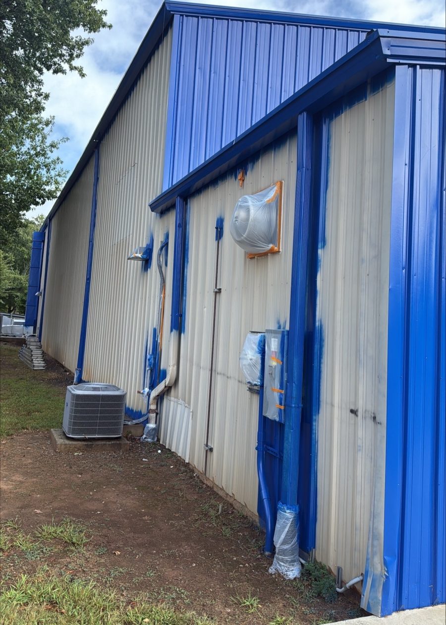 commercial building exterior during blue repaint project Preview Image 2