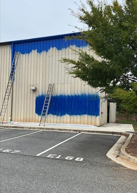 commercial building exterior during blue repaint project Preview Image 4