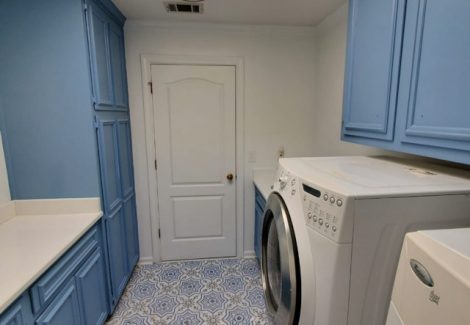 repainted cabinets in the laundry room of a house in alpharetta, georgia