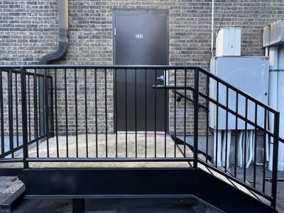 photo of repainted commercial door, stairs, and railing
