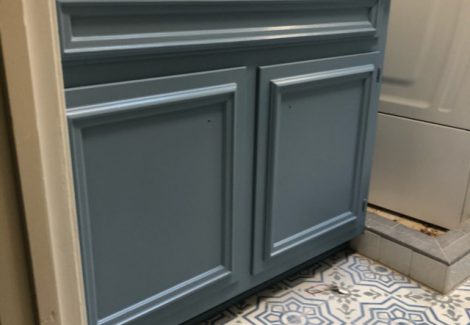 repainted cabinets in the bathroom of a house in alpharetta, georgia