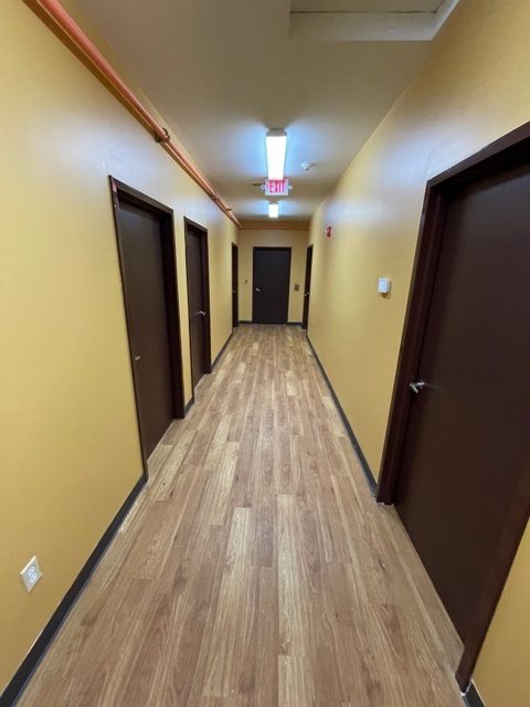 full view of the interior painting of the hallway with a golden color Preview Image 5