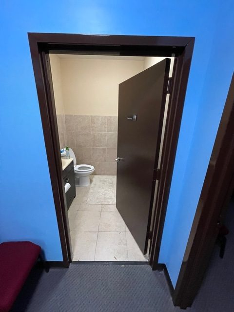 entrance hallway to bathroom painted a bright blue Preview Image 8