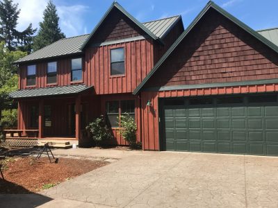 red wood home exterior painting