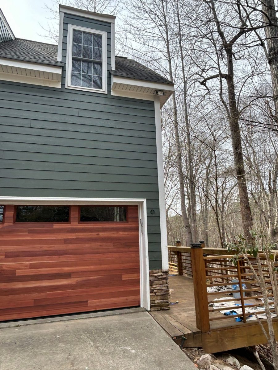house with wooden garage door and grey blue painted siding Preview Image 5