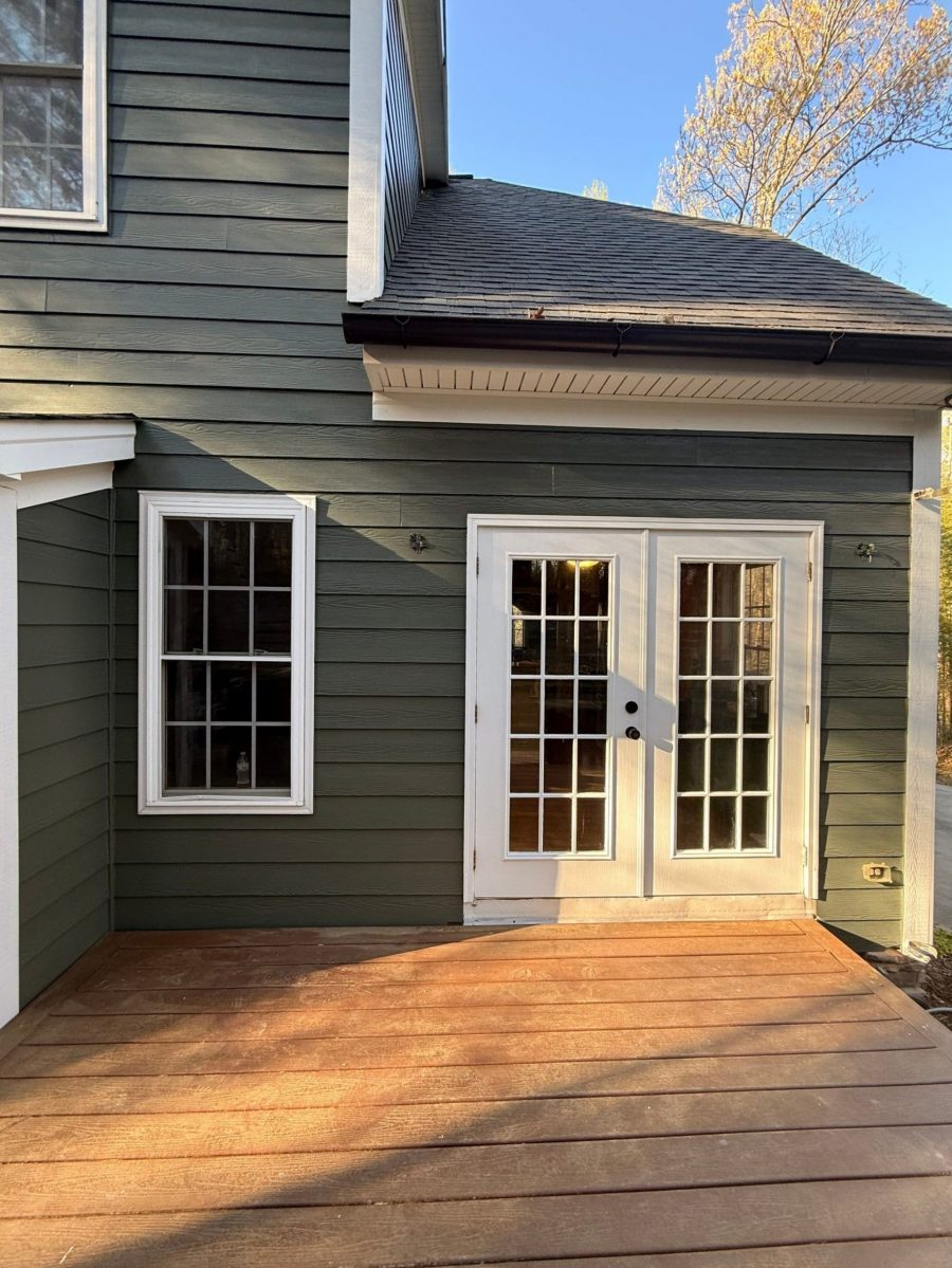 home exterior entrance with blue siding and white doors Preview Image 3