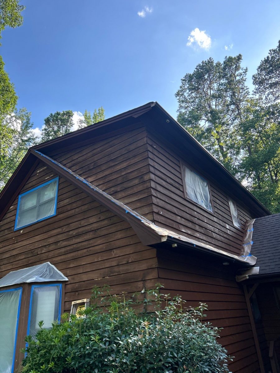 exterior of house with wood siding during stain Preview Image 2