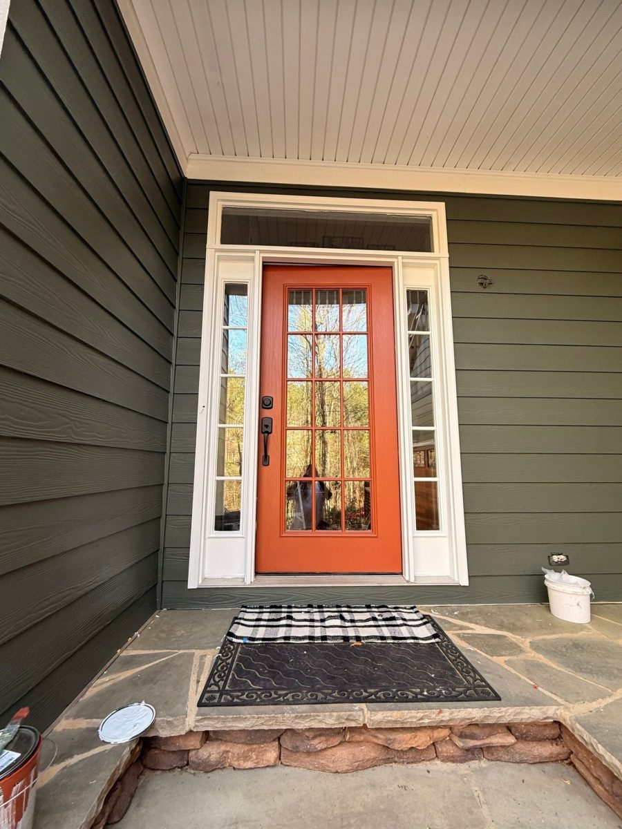 home exterior entryway with blue siding and orange painted door Preview Image 1