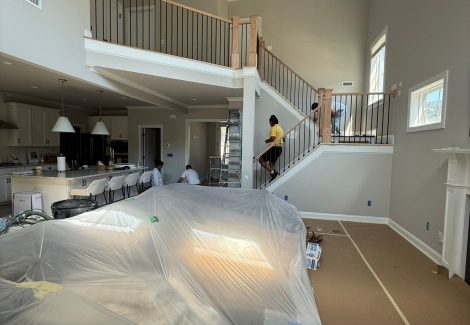 home interior with protective coverings during painting project