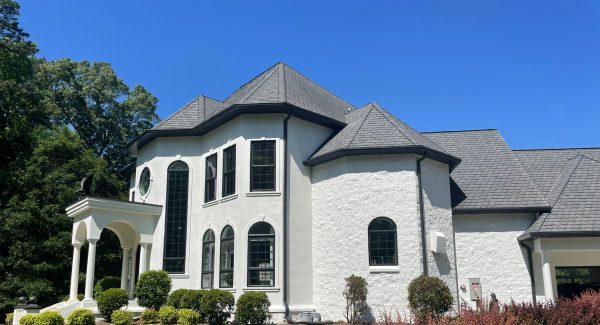 white painted stucco house with black trim