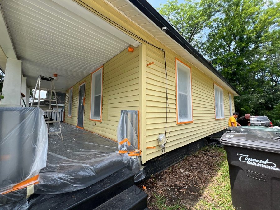 house exterior with yellow siding prepped for painting Preview Image 11