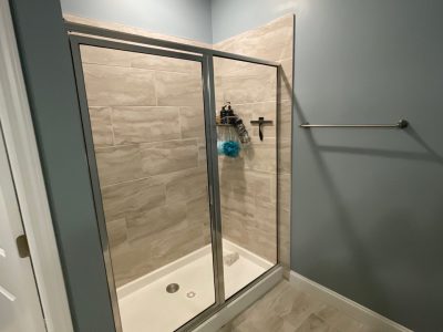 blue painted bathroom and shower stall