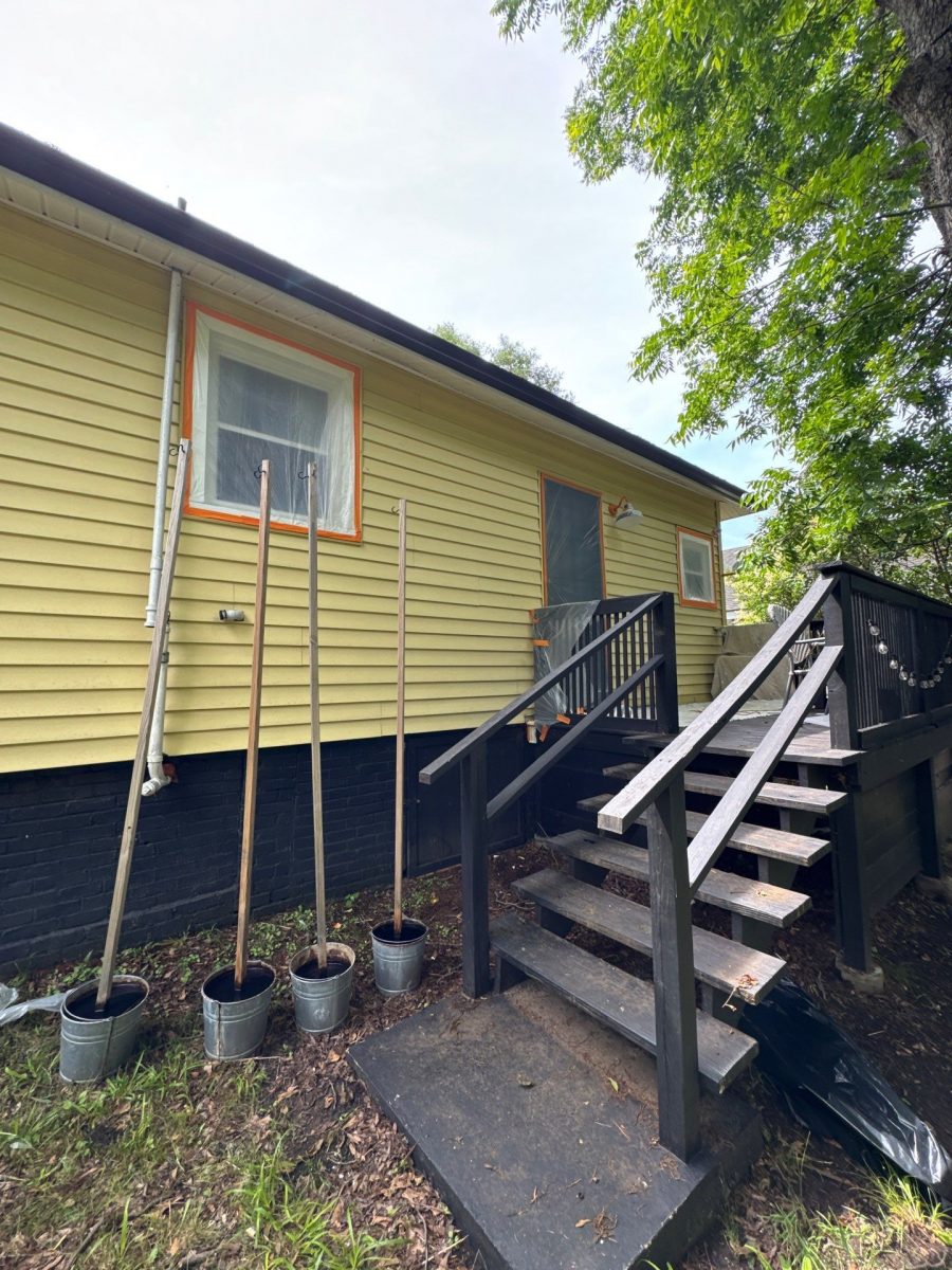 house exterior with yellow siding prepped for painting Preview Image 12