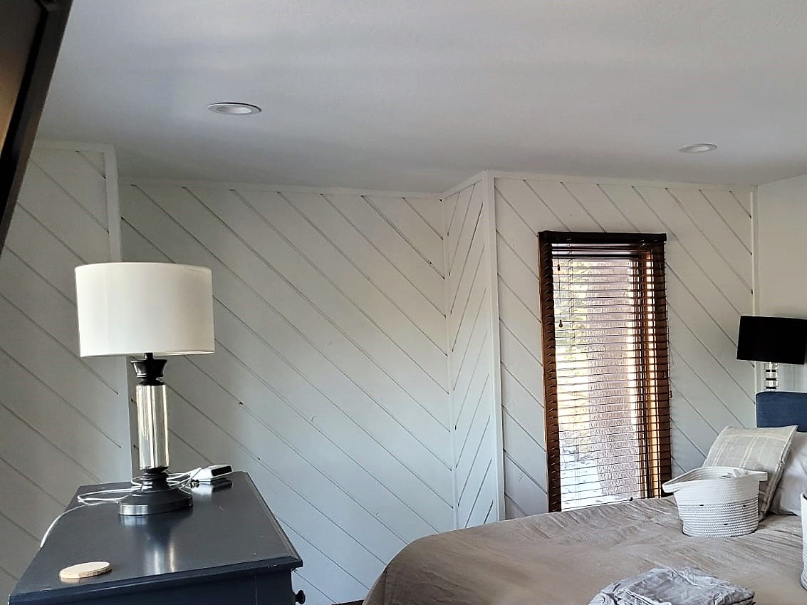 white painted wood panel wall