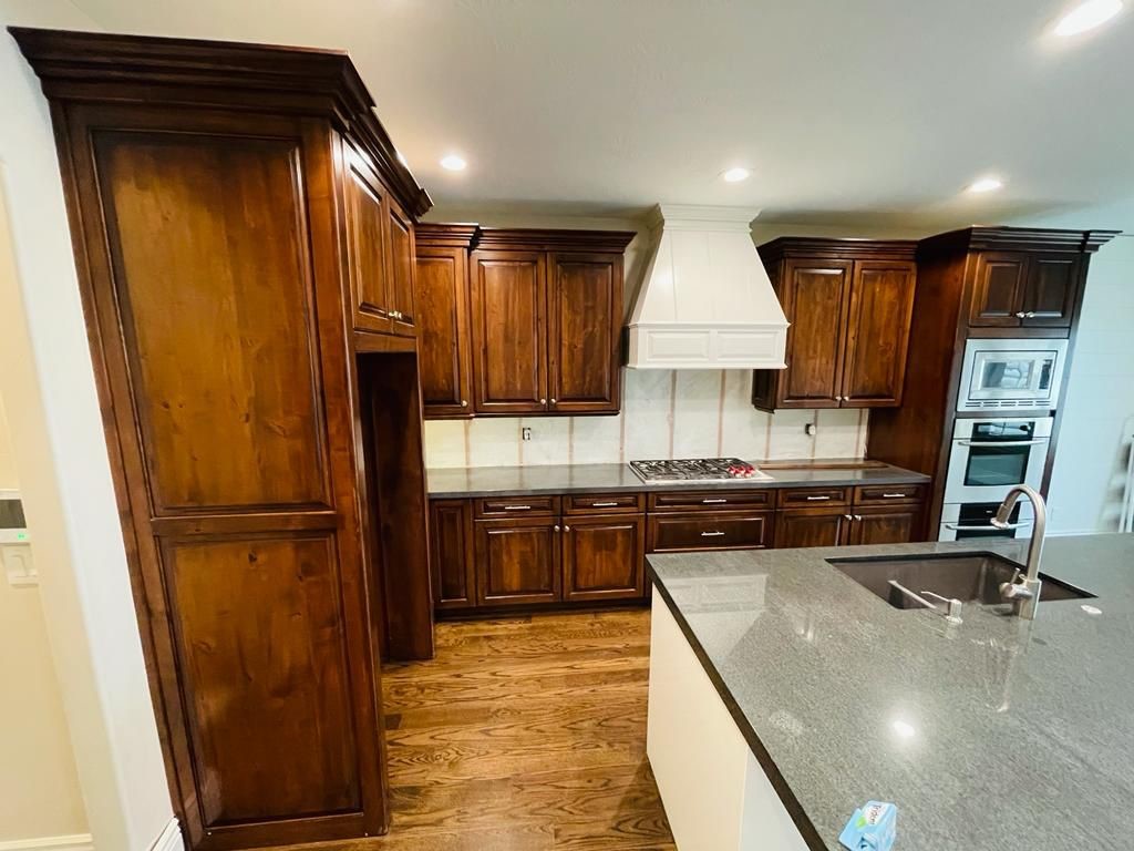 Before the kitchen cabinets were repainted white.