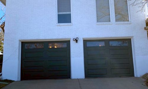 White Brick Home with Painted Garage Doors