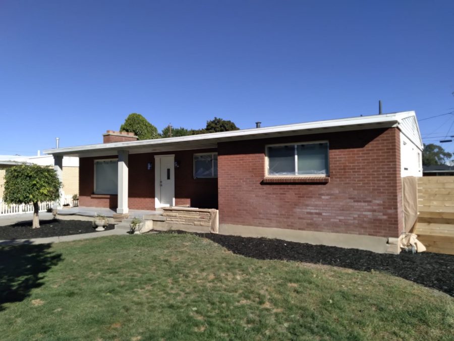 A before image of a house in Murray Utah that has a brick exterior. Preview Image 1