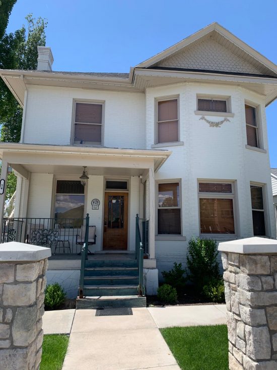 front of white painted house