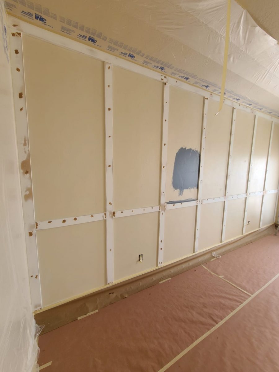 photo of a paneled wall before painting project began Preview Image 1
