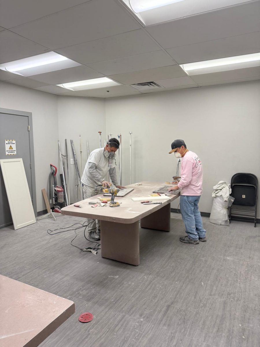 painters sanding cabinet doors Preview Image 3