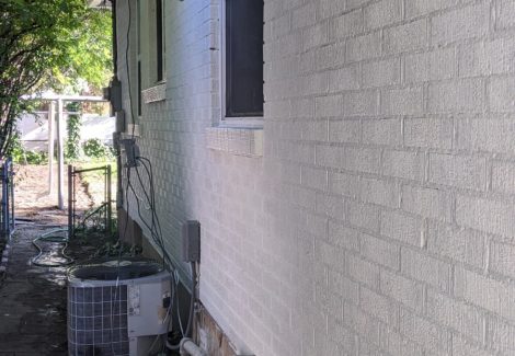 Brick siding repainted white