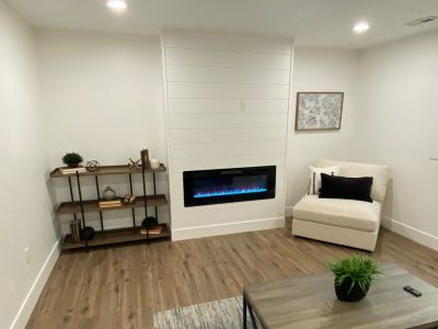 living room and fireplace painted white.