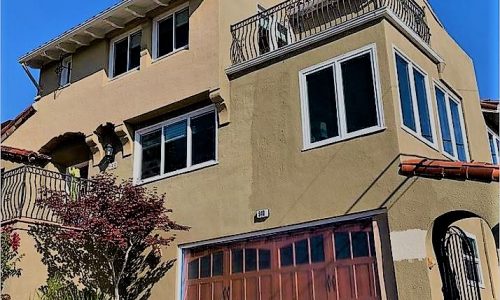 A stucco home in light tan
