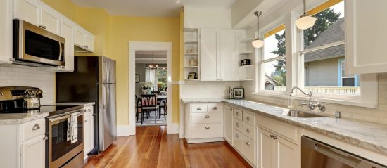 Kitchen with white cabinets repainted by CertaPro