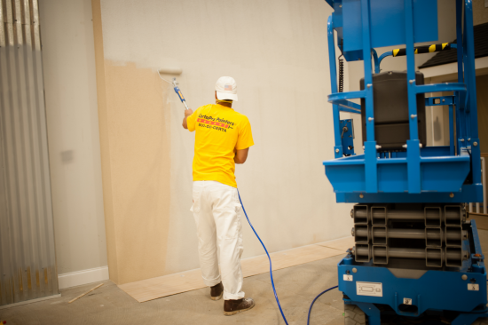 CertaPro Team Member Painting an interior wall