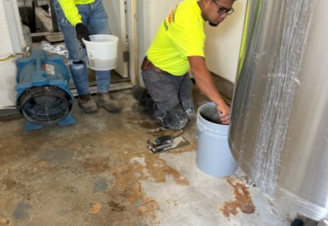 Gill Dairy Case Study floor before photo of flooring being prepared behind equipment