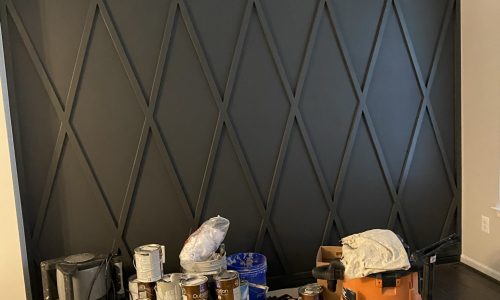 Black on black carpentry accent wall