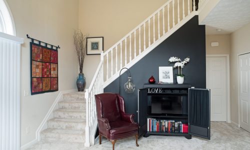 Townhome With Black Staircase Accent Wall