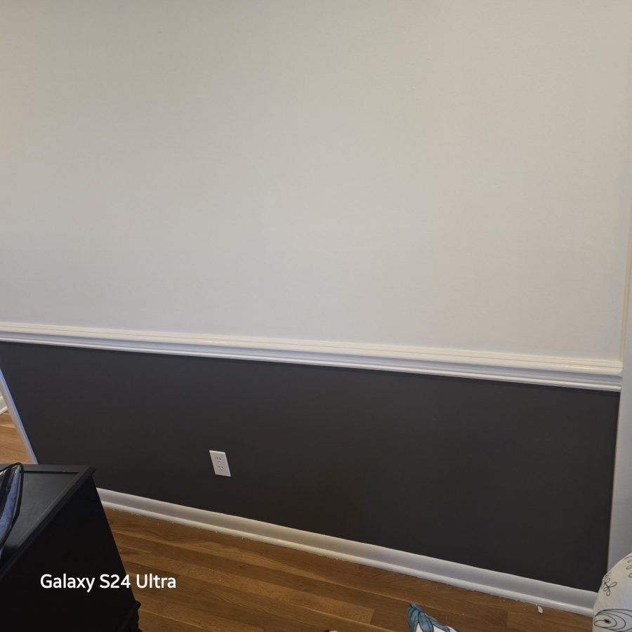 home hallway with walls painted dark and white, separated with trim Preview Image 4
